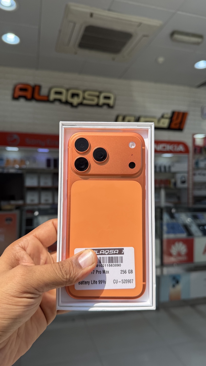 Orange iPhone 17 Pro Max at the shop