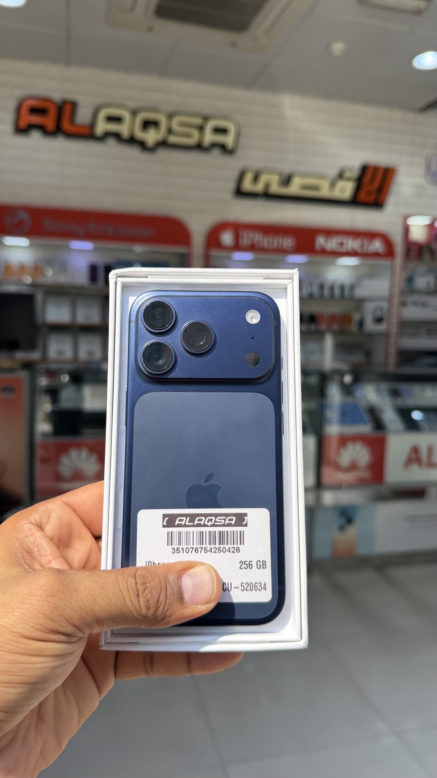Blue iPhone displayed at Al Aqsa Phone Service Center