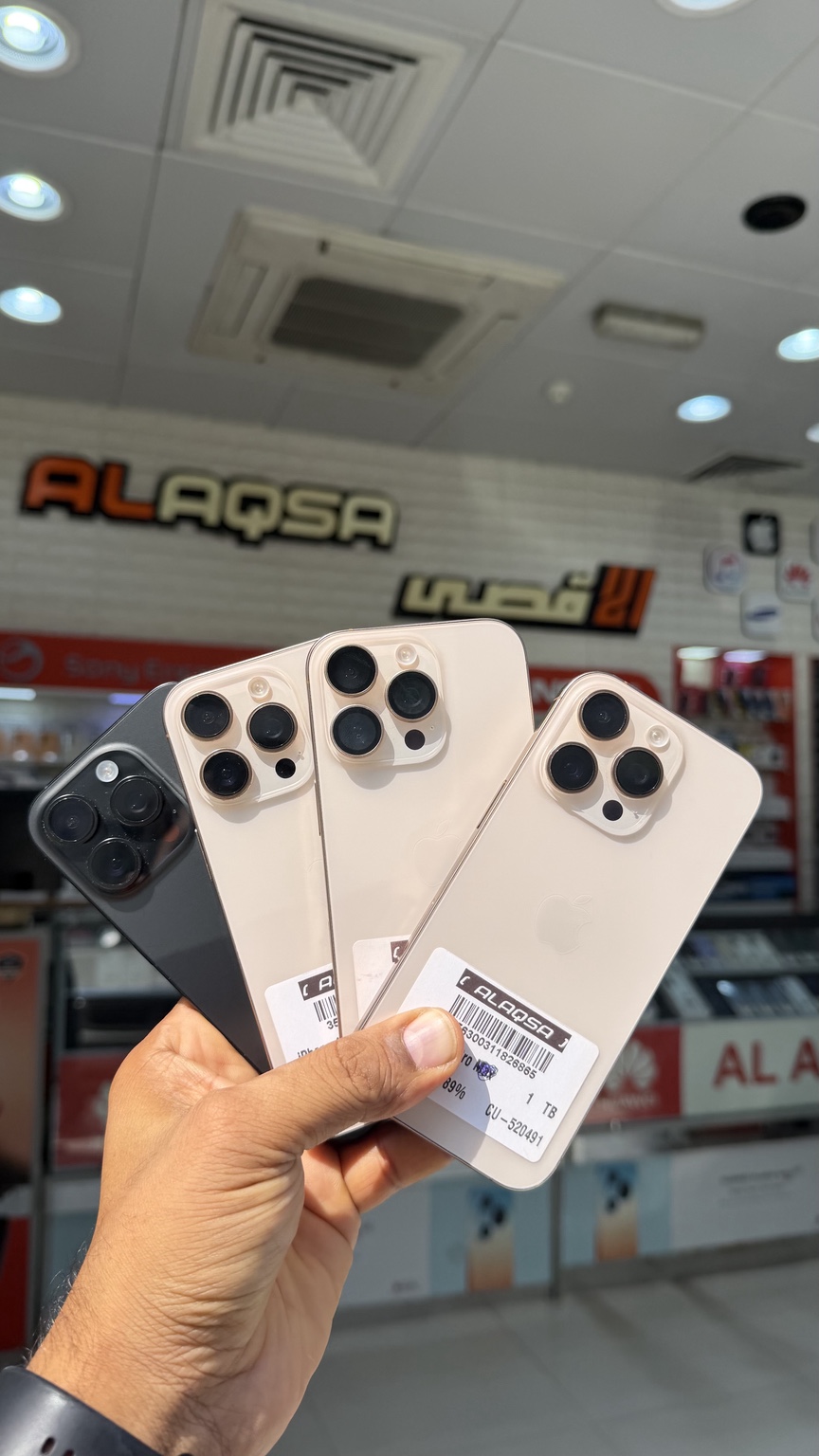 Collection of iPhone Pro models at Al Aqsa Phone Service Center