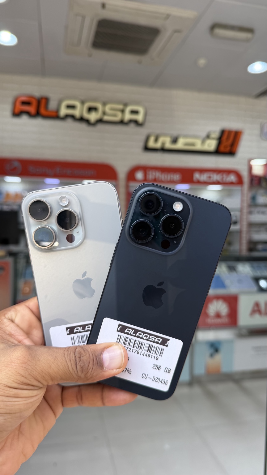 Two iPhone Pro models at the shop
